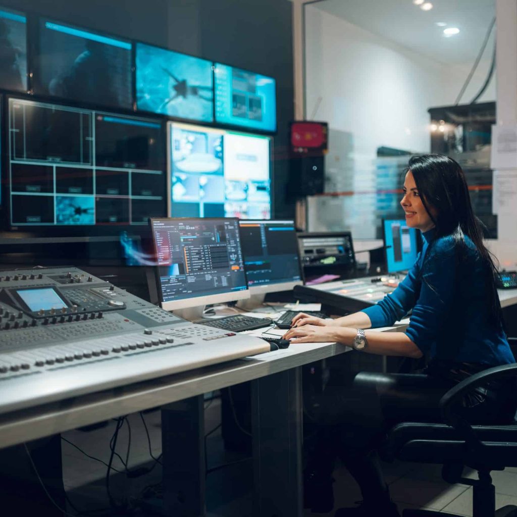 middle-aged-woman-using-equipment-in-control-room-2023-11-27-05-36-04-utc-scaled-1.jpg